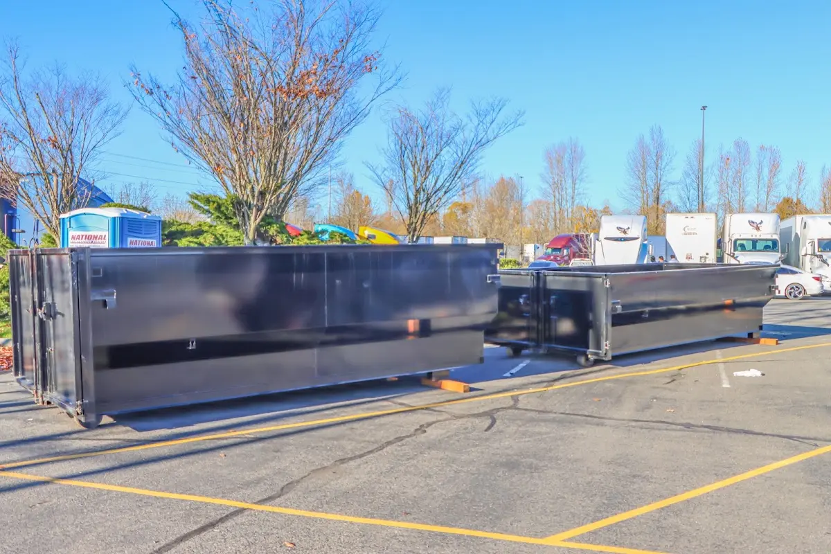 Professional dumpster rental service with roll-off container on residential driveway in Galesburg